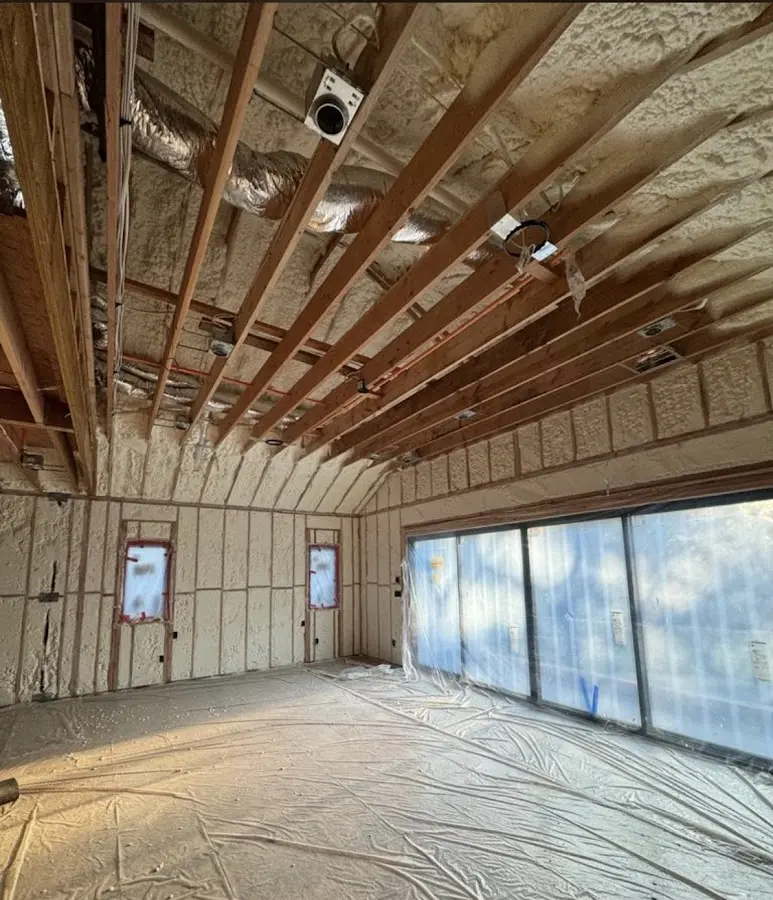 Interior walls and ceiling insulated with spray foam during new construction in Fruitvale